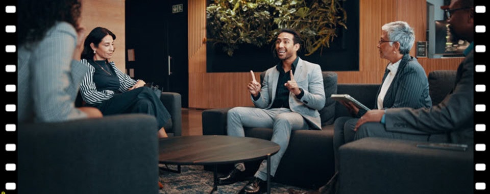 Group of diverse people discussing at Vero Beach Film Festival event.