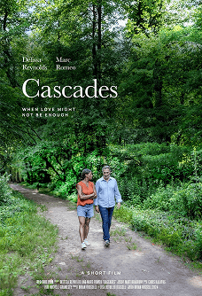 Two people walking along a forest trail in Cascades, Vero Beach Film Festival.